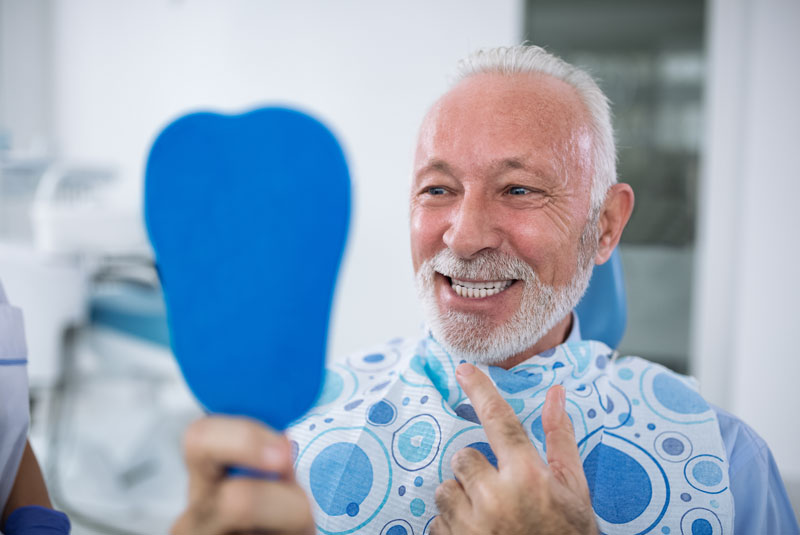 Dental Implant Patient Smiling After His Procedure