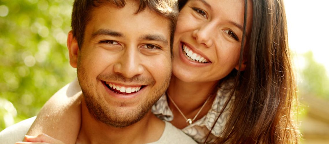 Dental Patients Smiling With Well Cared For Dental Implants In Alexandria, VA