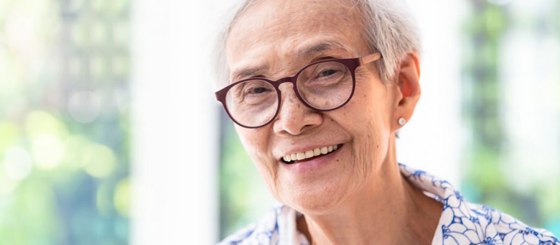 Dental Implant Supported Dentures Patient Smiling Happily In Alexandria, VA