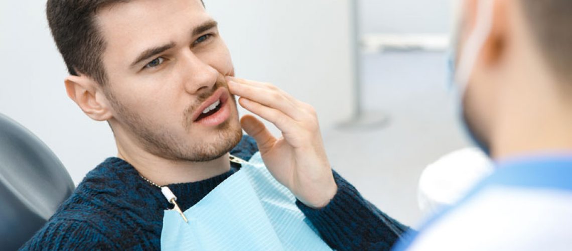 Dental Patient Suffering From Mouth Pain On A Dental Chair, In Alexandria, VA