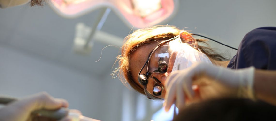 Dentist Performing the Chao Pinhole® Surgical Technique On A Gum Recession Patient